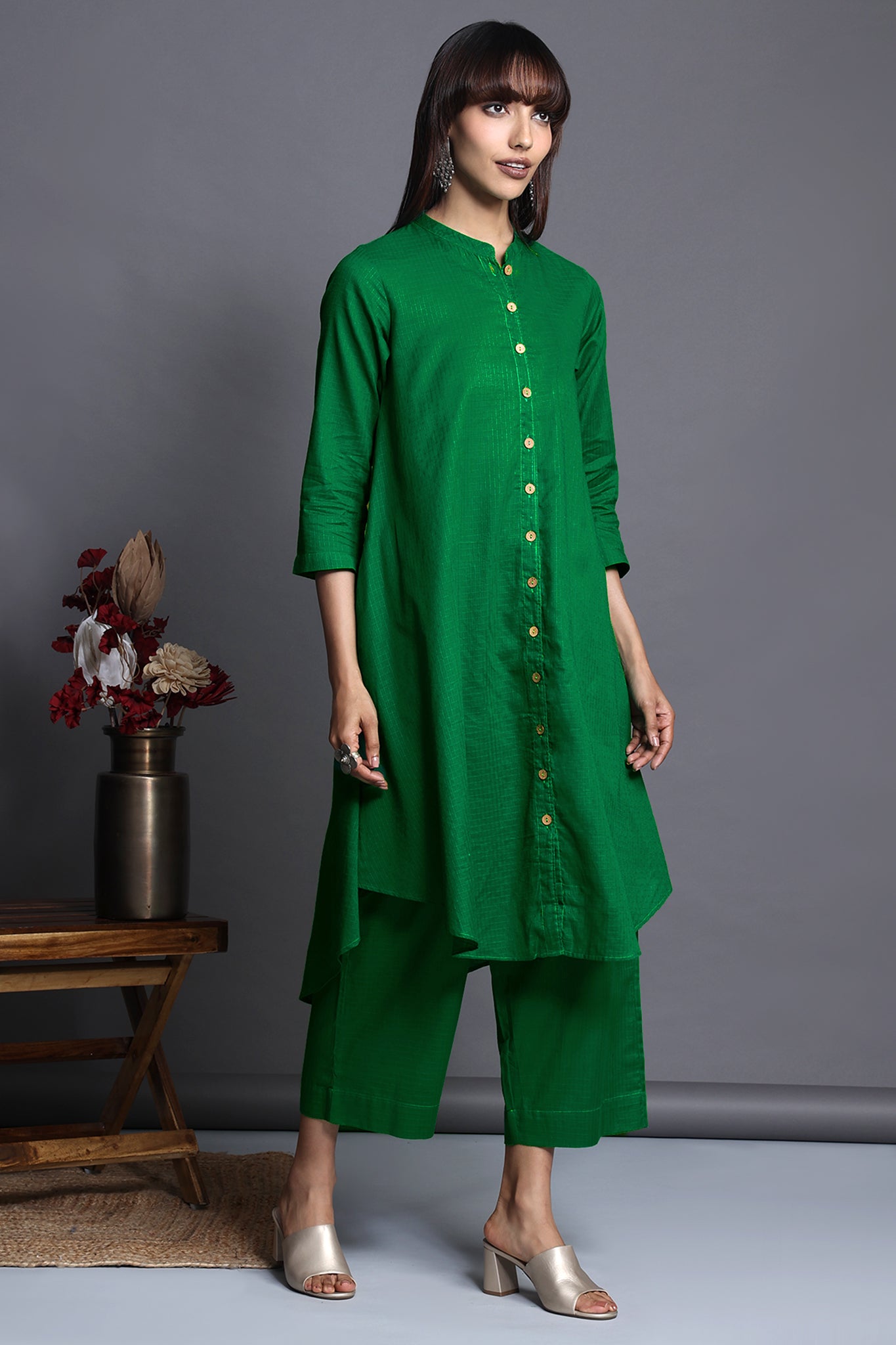 Asymmetric apple cut round knee length hemline button down kurta with pockets green with self checks cotton 