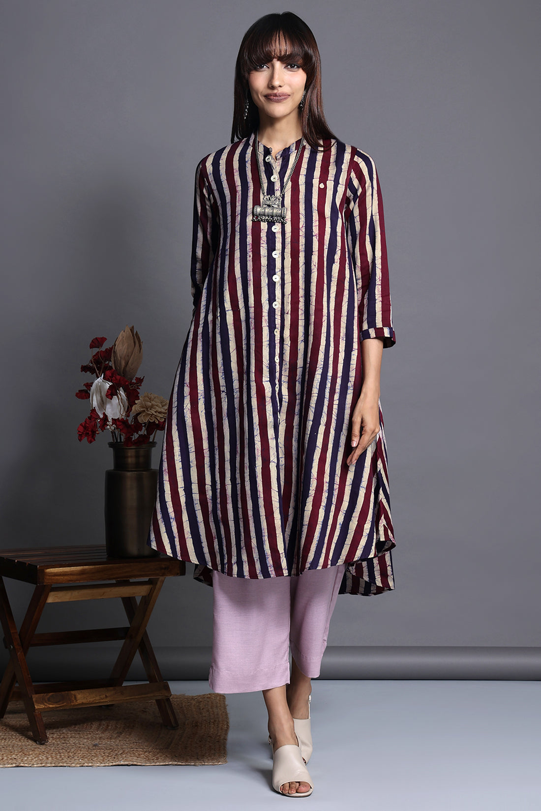 Asymmetric apple cut round knee length hemline button down kurta with pockets purple blue stripes in batik satin fabric  