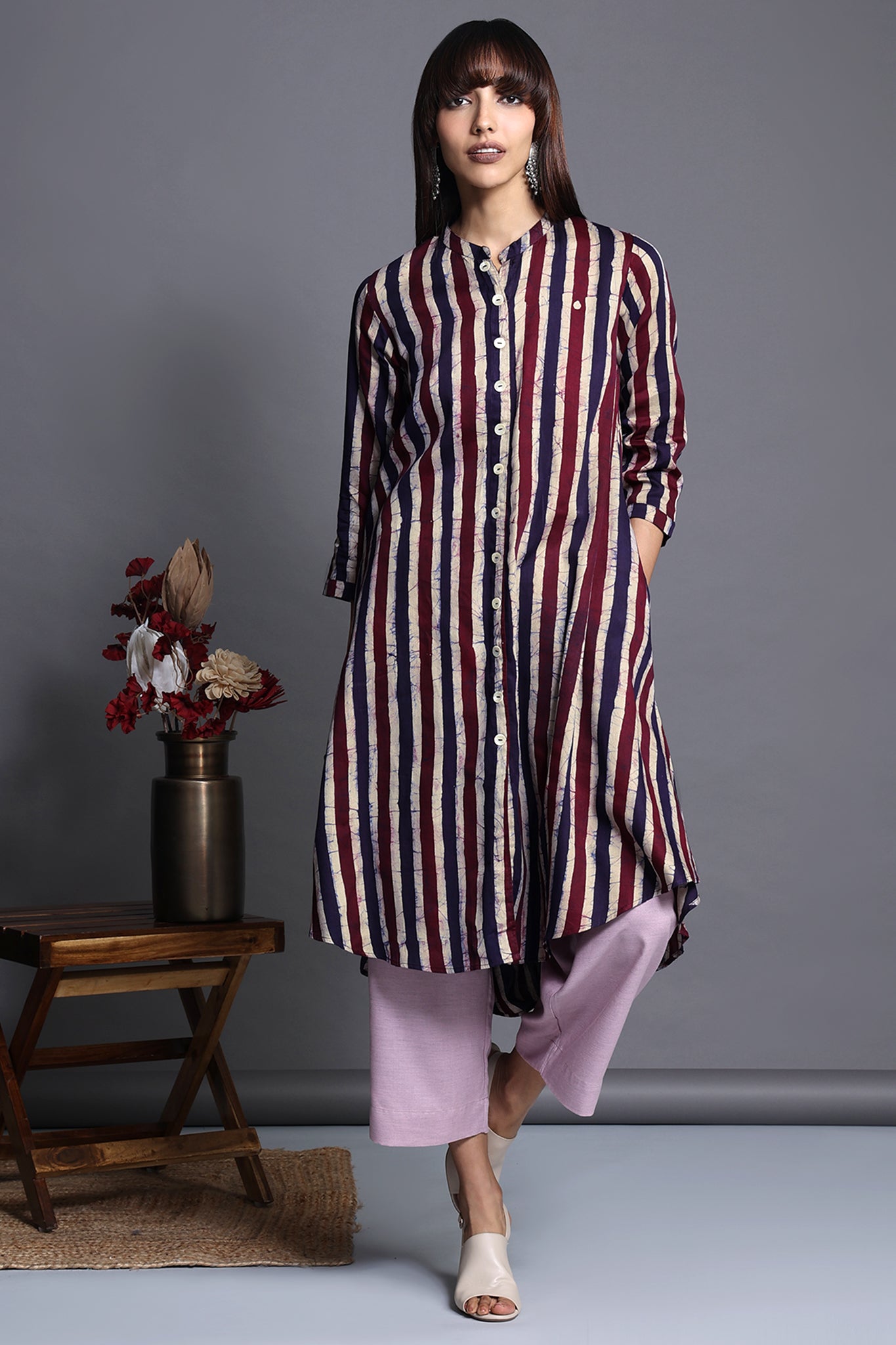 Asymmetric apple cut round knee length hemline button down kurta  with pockets purple blue stripes in batik satin fabric  