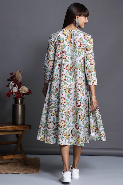 Vintage swirl flare dress in white delicate floral print with high bust yoke and gathers with green printed trims