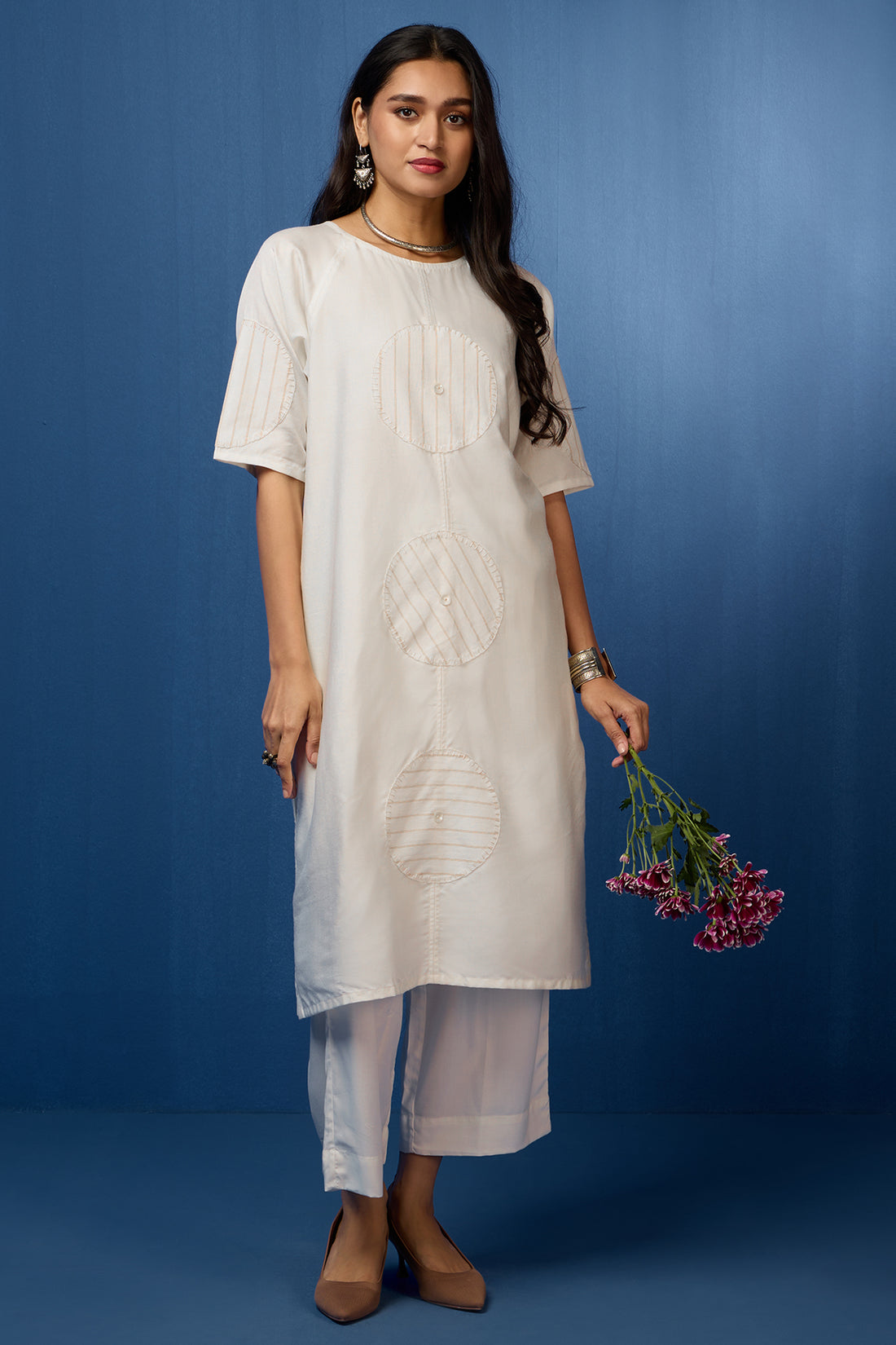 White silk kurta with white applique embroidery.