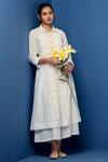 White cotton kurta with zari lines and buttons with pocketswhite applique embroidery.