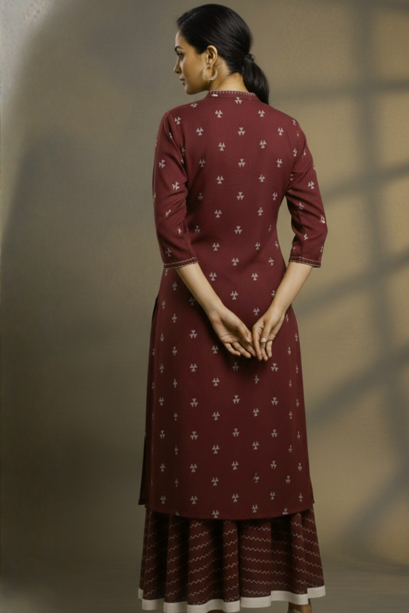 Coord set in maroon with white buti and flared skirt with cream silk trims