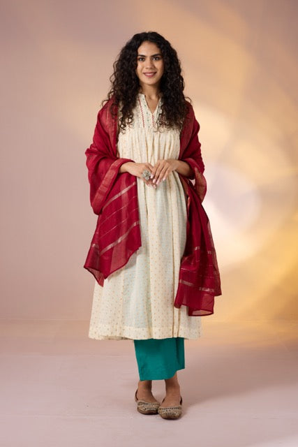 Pintuck Collar High Bust Anarkali In Ivory White Gold Dots And Pockets And Hand Embroidery  by Maati Crafts