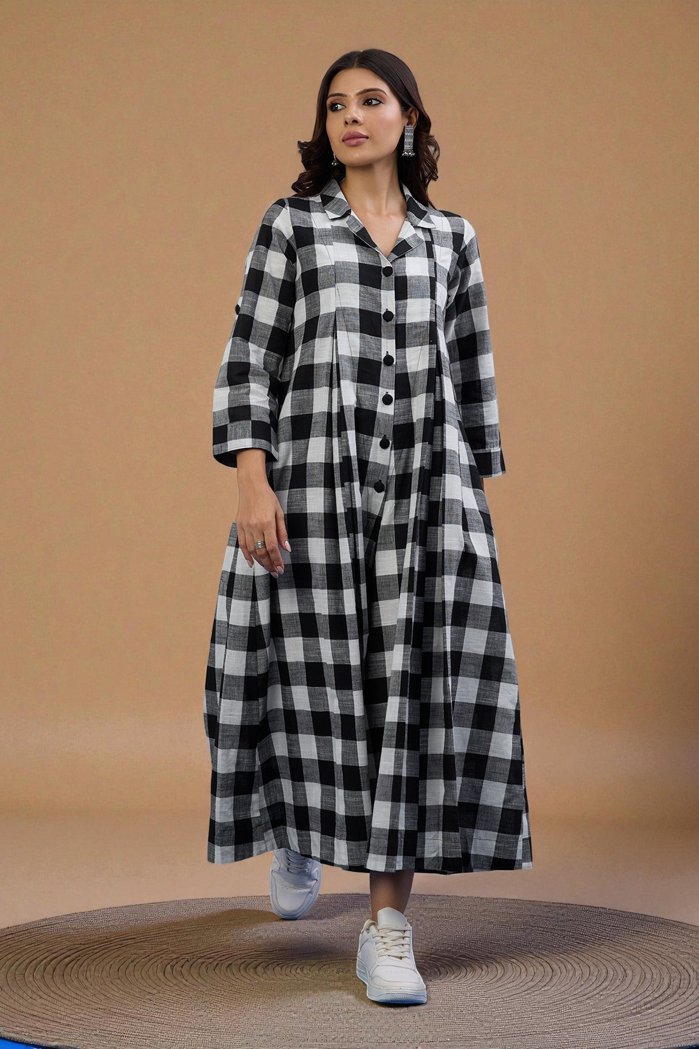 Woman wearing a black and white checkered jumpsuit