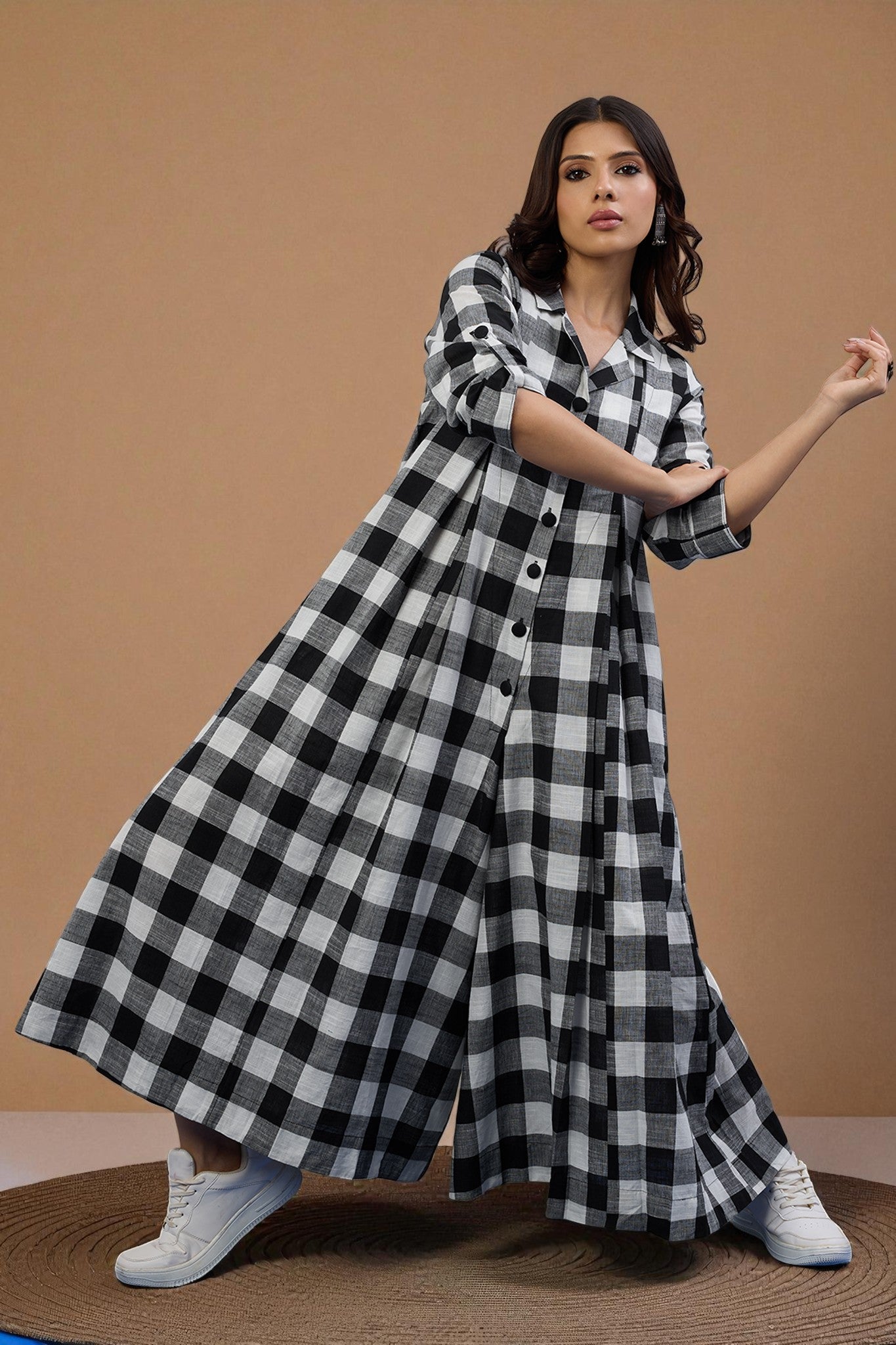 Woman wearing a black and white checkered jumpsuit