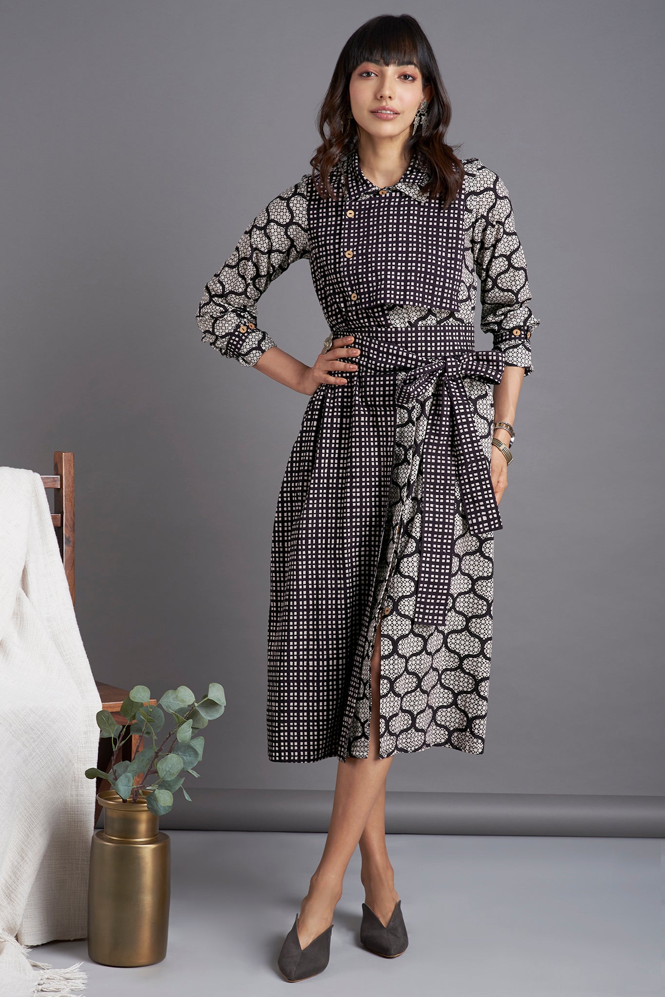 Black Bagh mosaic print Knee length dress with collar in black white checks and front flap with buttons and belt  and side pockets 