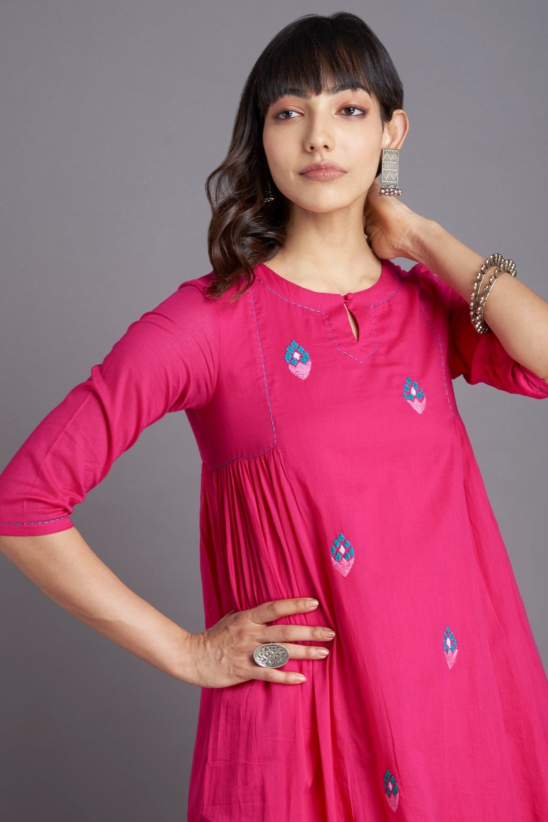 Rani pink mul cotton gather kurta with lining and pockets with delicate tulip hand embroidery in green and peach and with coordinated pants