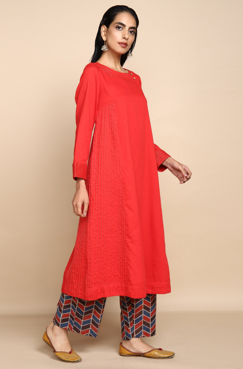 bright red mul kurta with lining with golden embroidery at the neck and wine red indigo ajrakh print straight pants