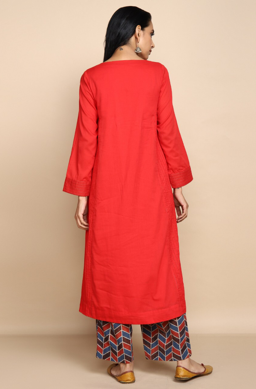 bright red mul kurta with lining with golden embroidery at the neck and wine red indigo ajrakh print straight pants