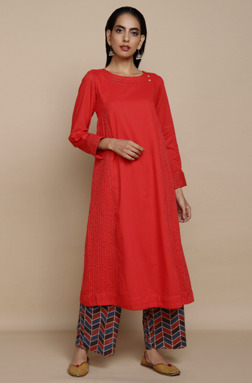 bright red mul kurta with lining with golden embroidery at the neck and wine red indigo ajrakh print straight pants